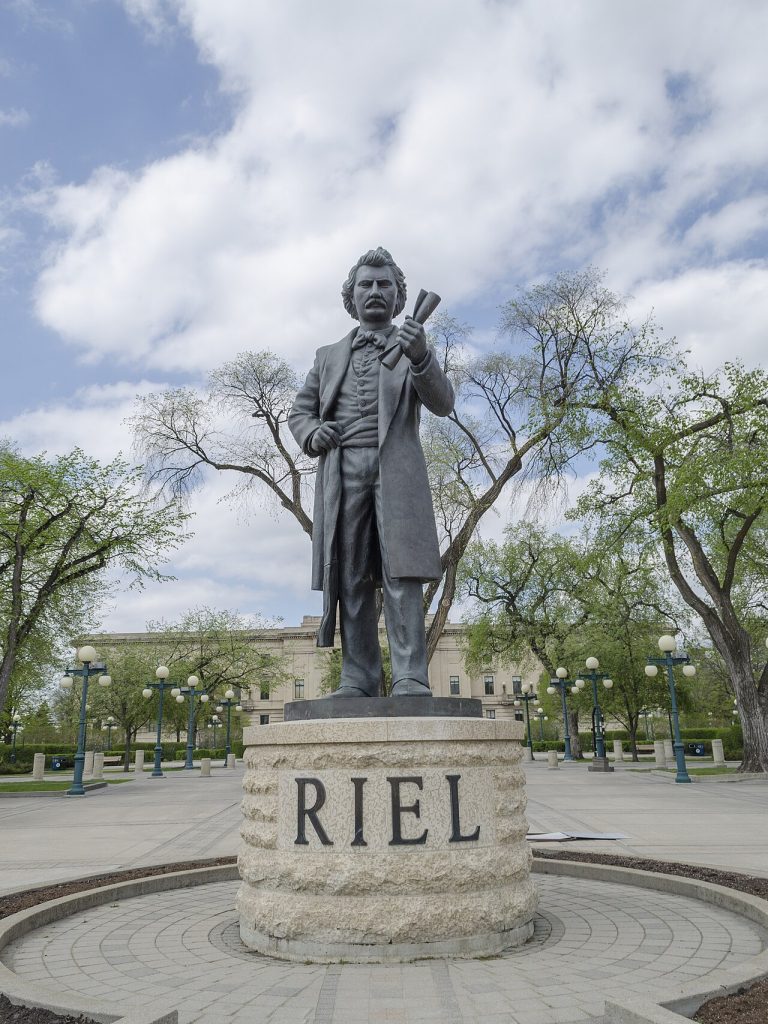 A modern statue of Louis Riel at the Manitoba Legislative Grounds in Winnipeg; not a photograph of the Convention of Forty in 1870.