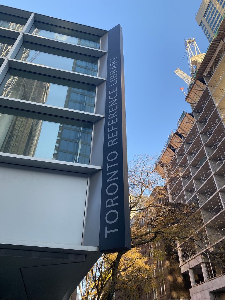 The exterior sign of the Toronto Reference Library, photographed in 2023; an illustration of reading and literary culture, not an awards ceremony.
