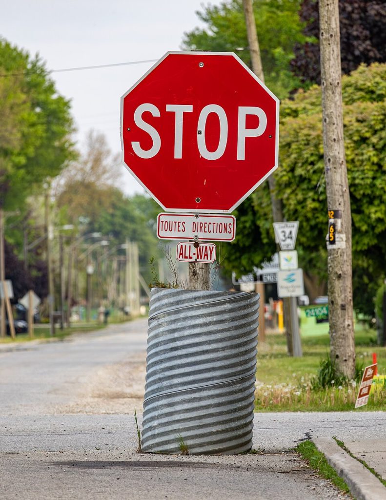 A bilingual stop sign in Pain Court, Ontario; a local example of English and French in public space.