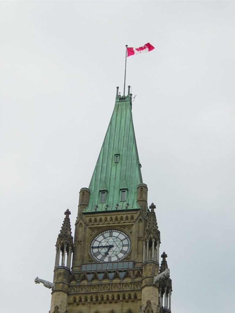The national flag flying above the Peace Tower, Ottawa, in 2003.