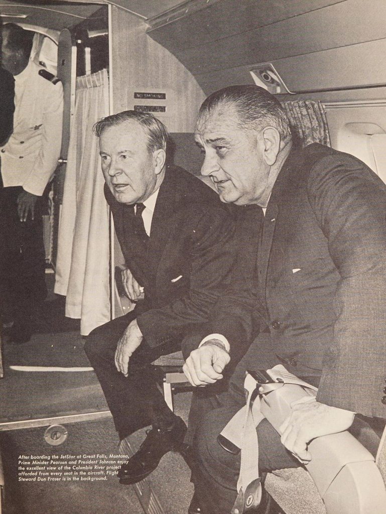 Lester B. Pearson with President Lyndon B. Johnson aboard a JetStar aircraft, September 16, 1964.