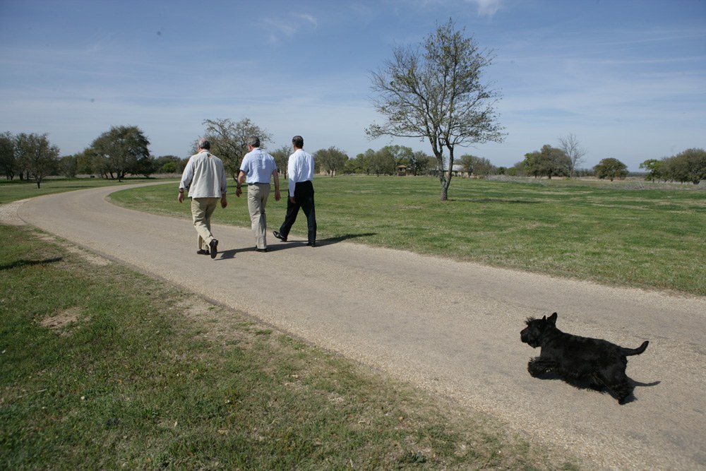 George W. Bush walks with Paul Martin and Vicente Fox in Crawford, Texas, March 23, 2005.