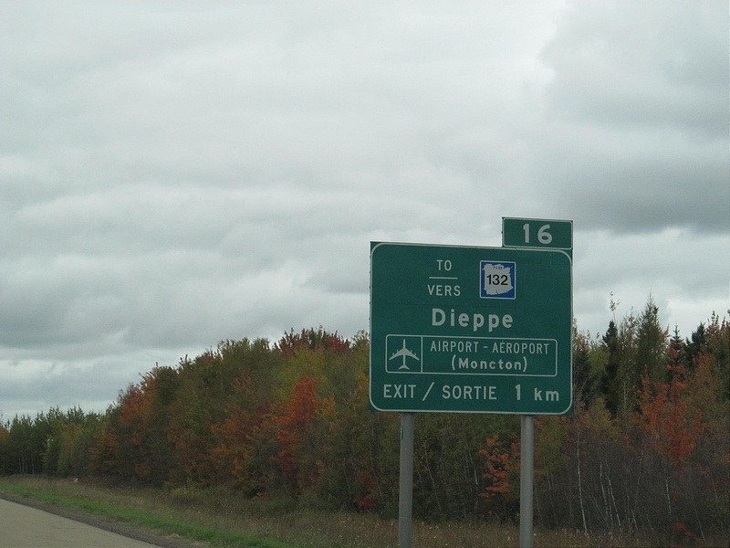 A bilingual road sign in New Brunswick pointing to Dieppe and the airport, photographed in 2012.
