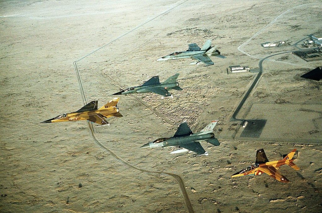 A Canadian CF-18 Hornet flying with coalition fighter jets during Operation Desert Shield.