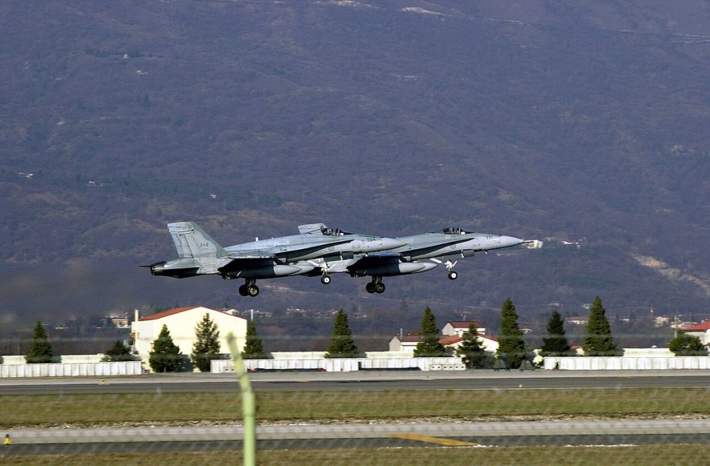 Canadian CF-18 aircraft departing Aviano Air Base, Italy, after supporting Operations Allied Force and Echo; photographed in December 2000.