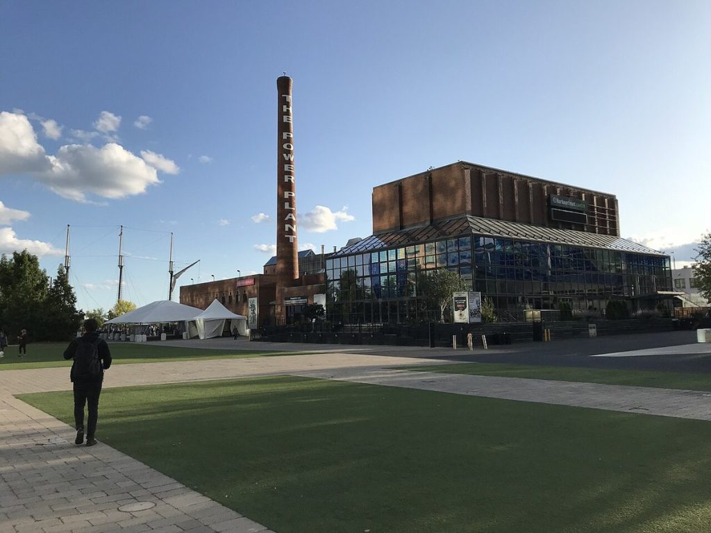 The Power Plant’s smokestack and neighbouring Harbourfront Centre buildings in Toronto, September 2019.