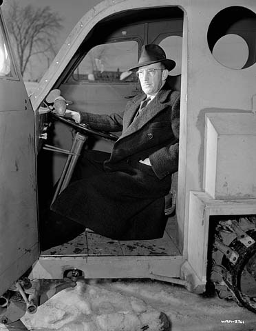 Joseph-Armand Bombardier at the wheel of a Bombardier military snowmobile, March 1943.